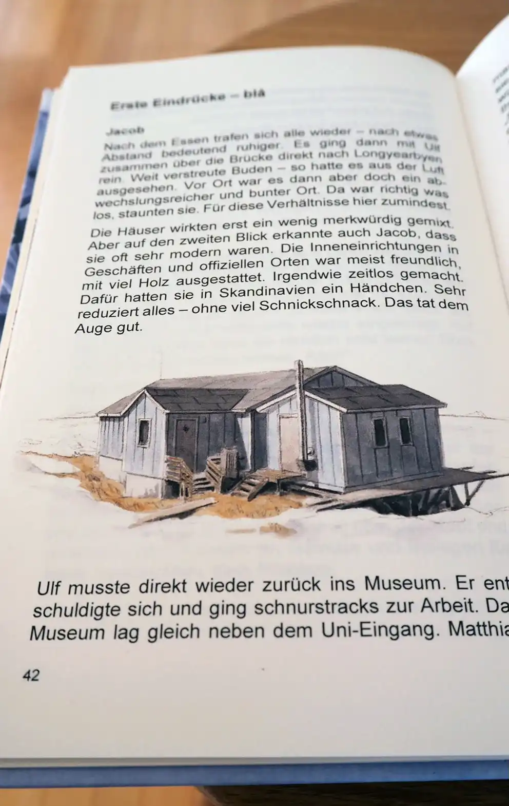 Buchseite mit Illustration einer Jagdhütte